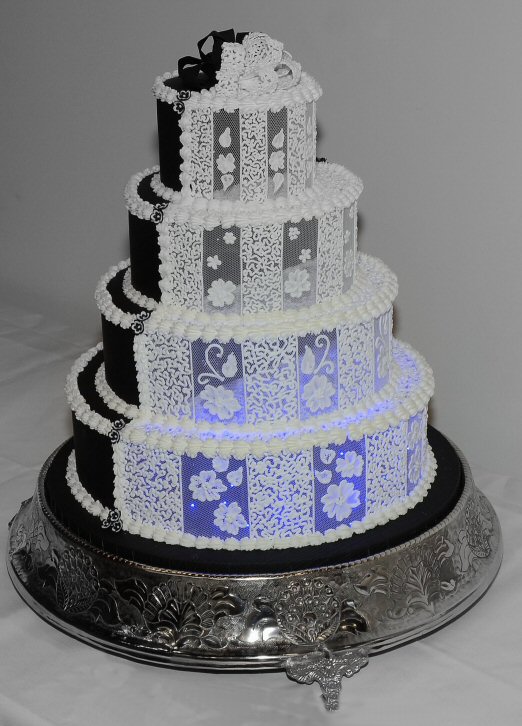 half and half black an white wedding cake lit with LEDs